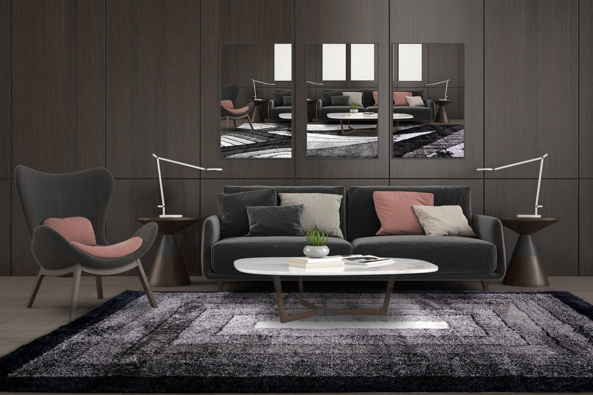 Black modern shaggy area rug styled in a bedroom from Rugs Australia